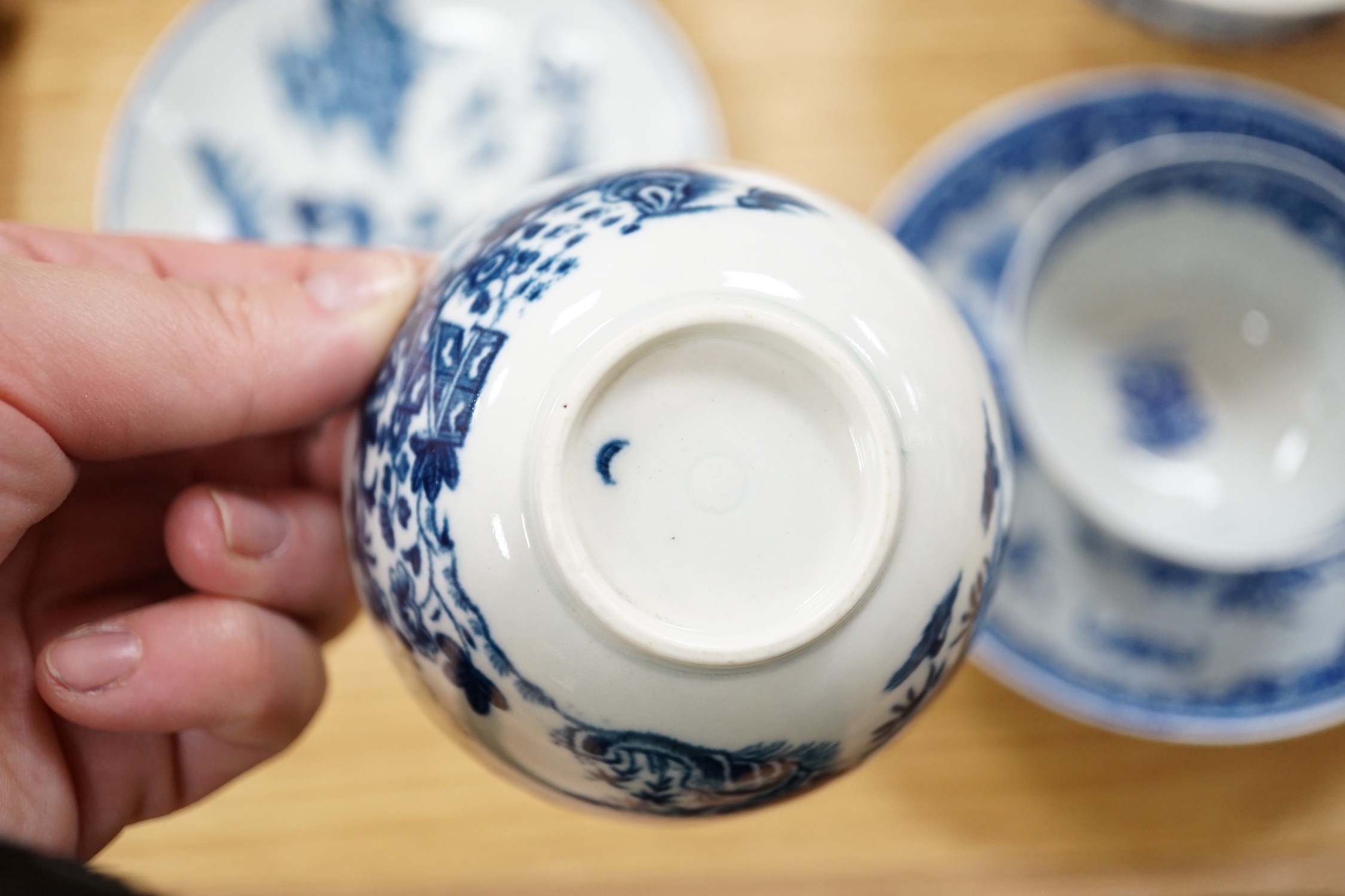 A Worcester teabowl and saucer printed with the Bat pattern, a coffee cup and saucer with the Argument pattern, another with the Fence pattern and a similar bowl and a very interesting pearlware bowl